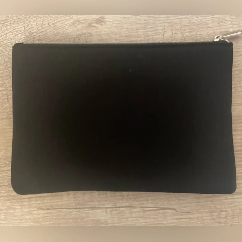 Authentic Dior flat pouch in Black. New. Comes with box.